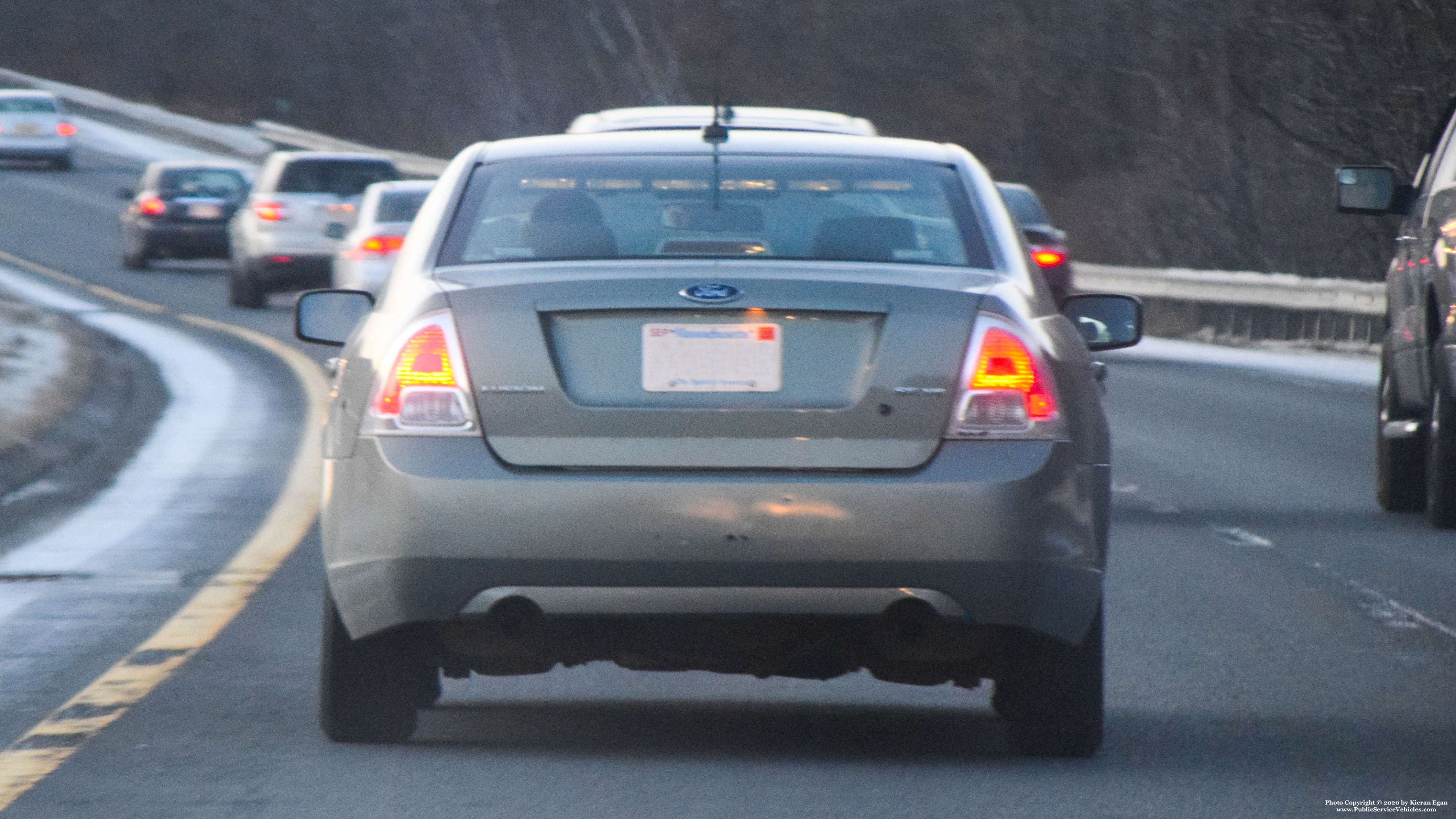 A photo  of Massachusetts State Police
            Unmarked Unit, a 2010-2012 Ford Fusion             taken by Kieran Egan