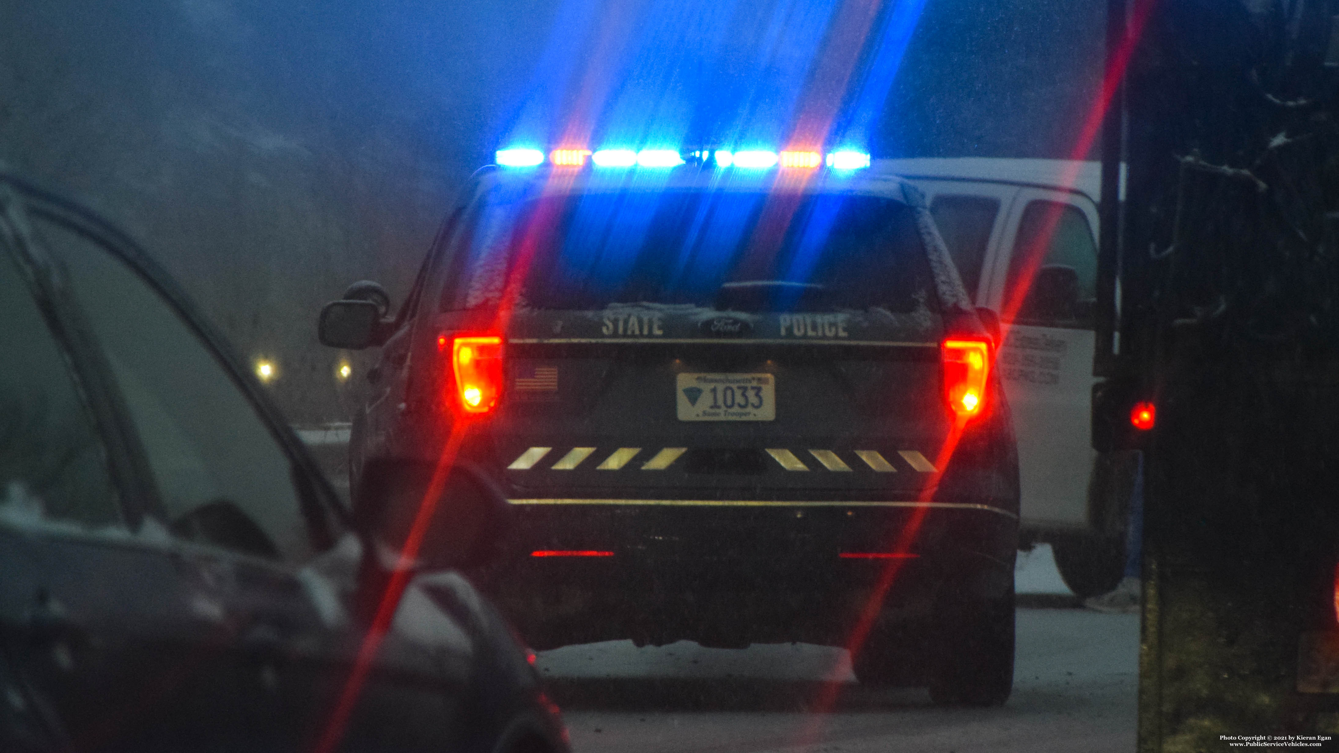 A photo  of Massachusetts State Police
            Cruiser 1033, a 2018 Ford Police Interceptor Utility             taken by Kieran Egan