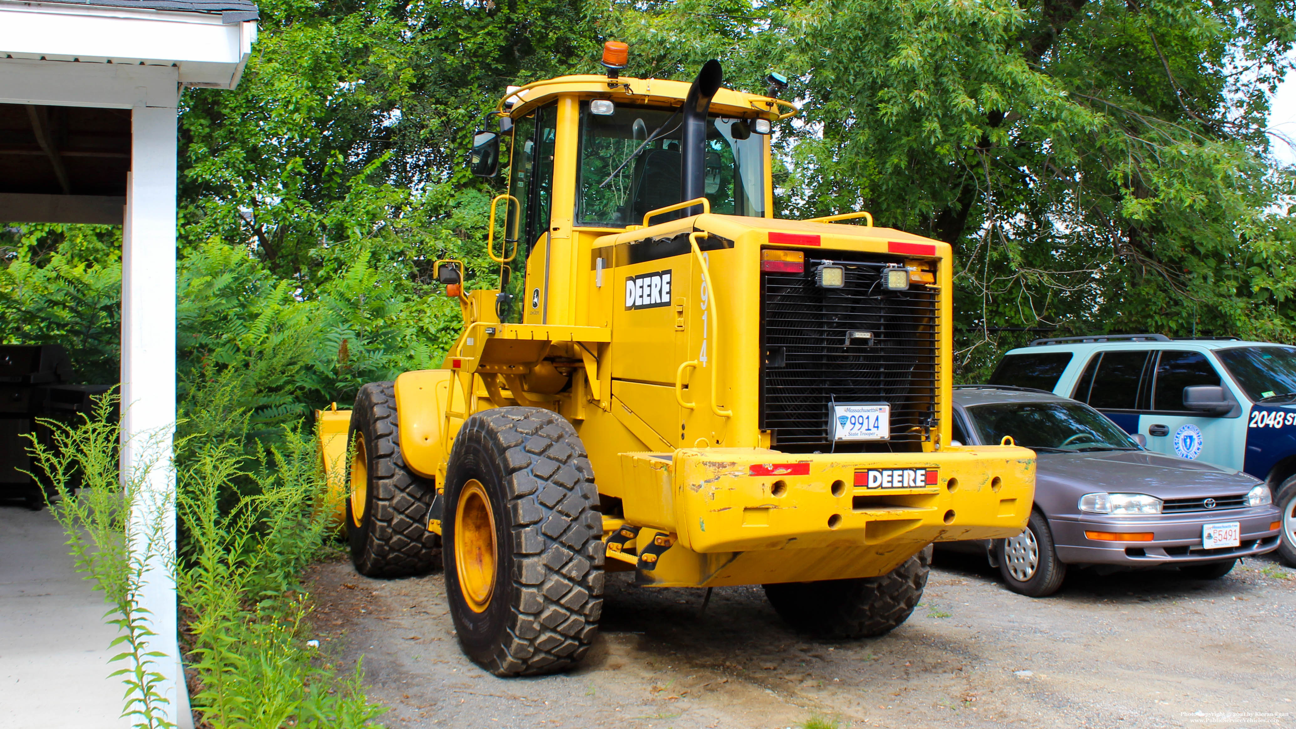 A photo  of Massachusetts State Police
            Front End Loader 9914, a 1990-2010 John Deere Front End Loader             taken by Kieran Egan
