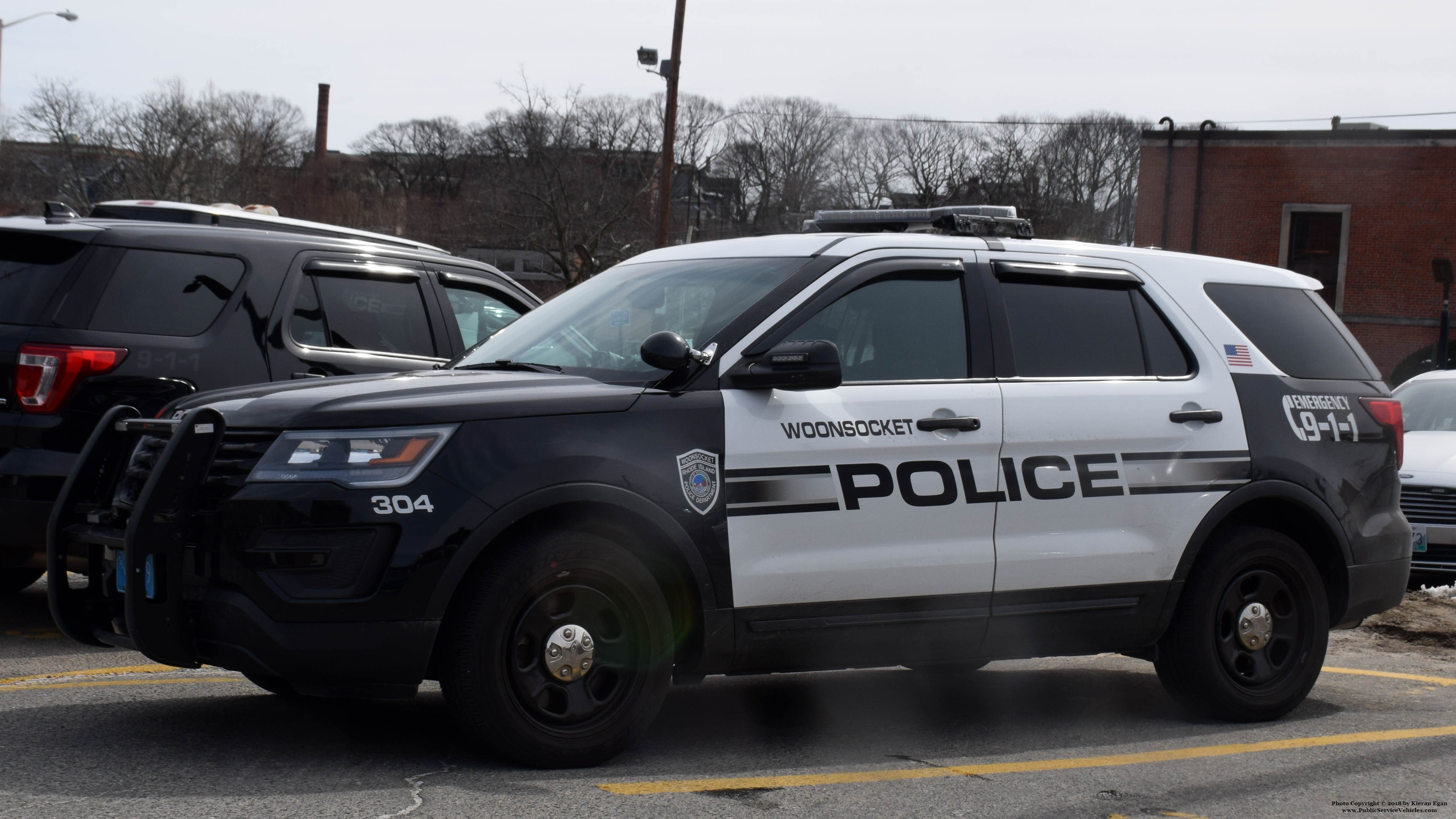 A photo  of Woonsocket Police
            Cruiser 304, a 2016-2018 Ford Police Interceptor Utility             taken by Kieran Egan