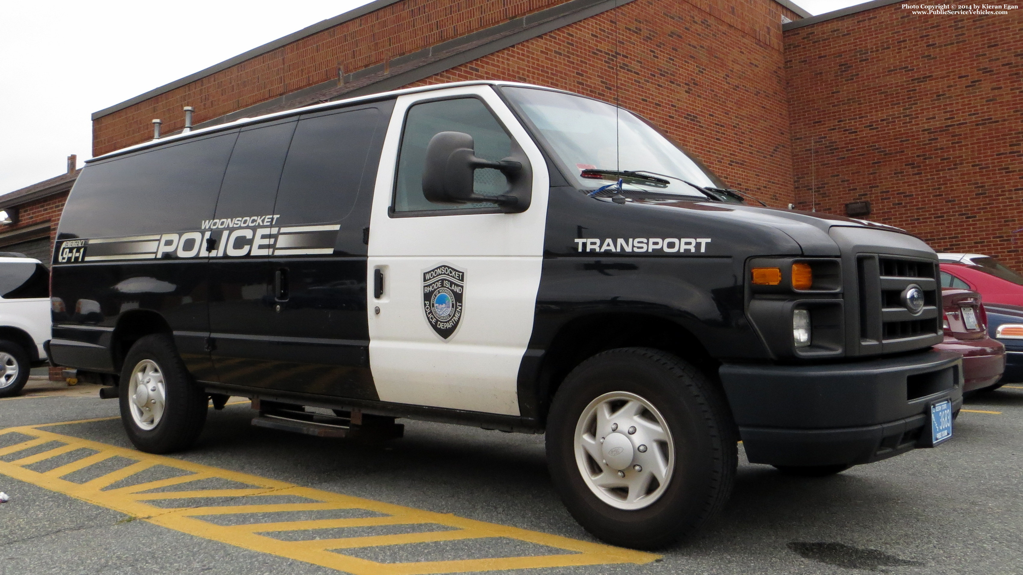 A photo  of Woonsocket Police
            Prisoner Transport Unit, a 2008-2014 Ford Econoline             taken by Kieran Egan