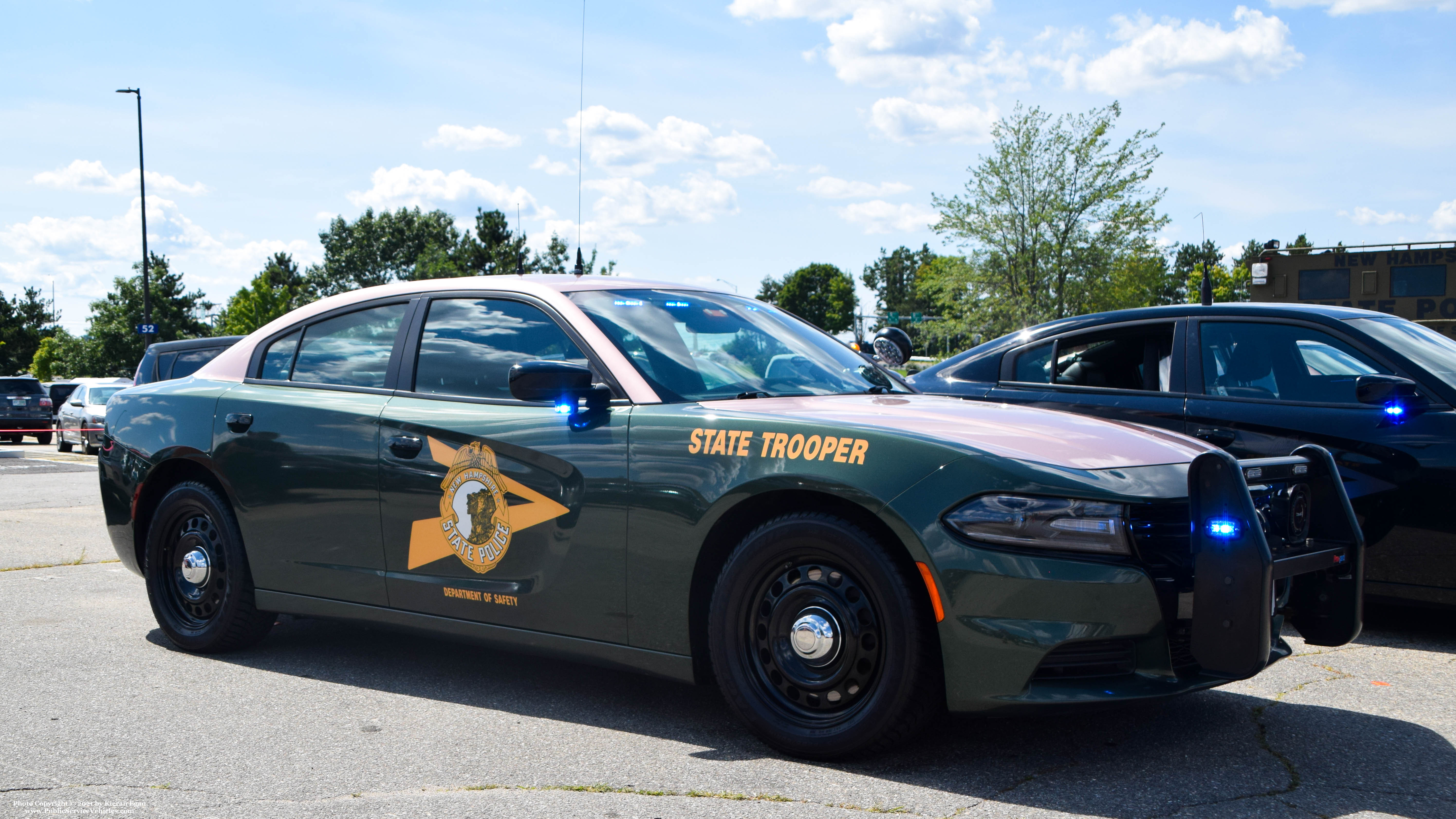 A photo  of New Hampshire State Police
            Cruiser 211, a 2017-2019 Dodge Charger             taken by Kieran Egan