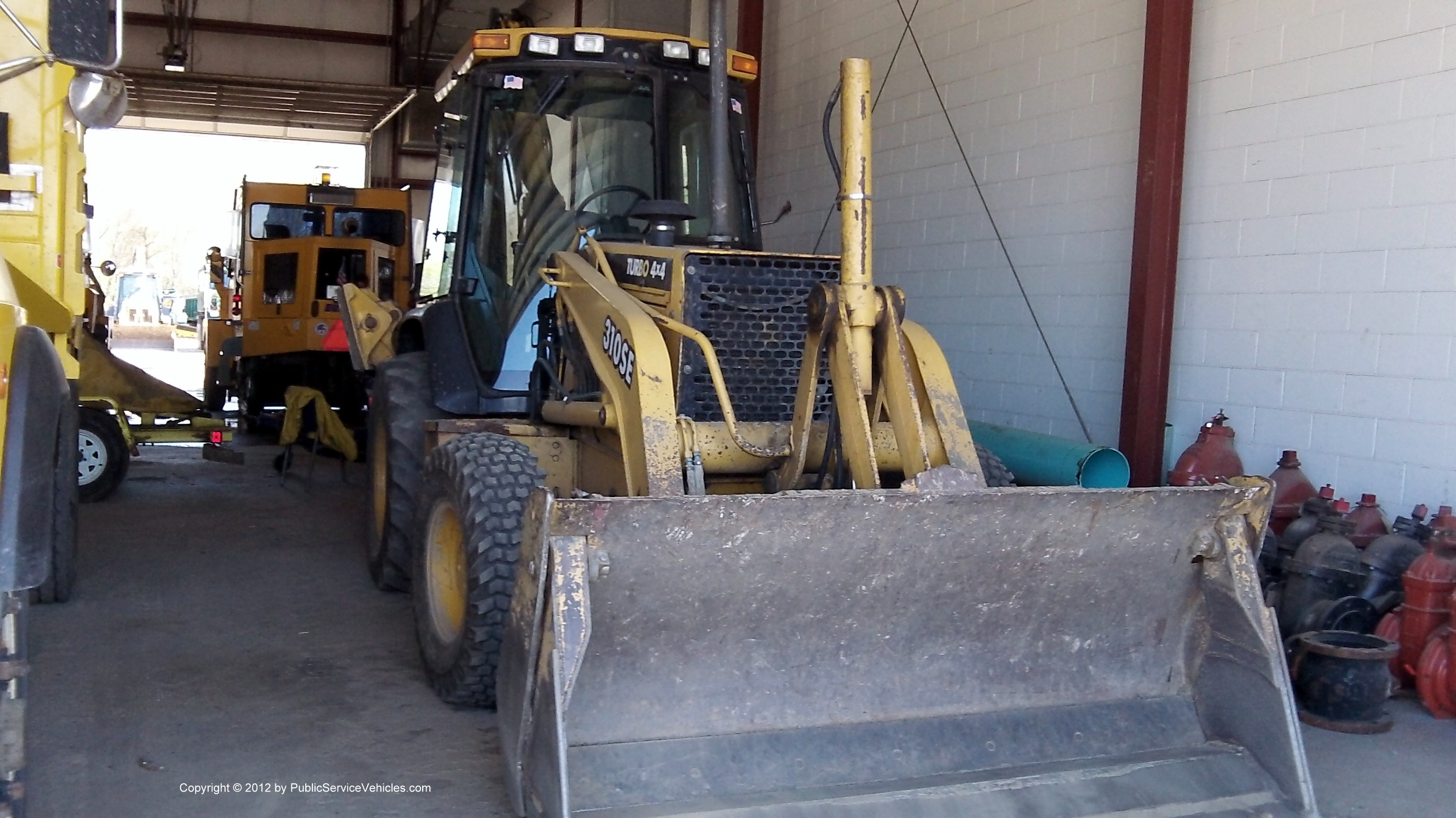 A photo  of East Providence Highway Division
            Backhoe 299, a 1990-2010 John Deere 310SE             taken by Kieran Egan