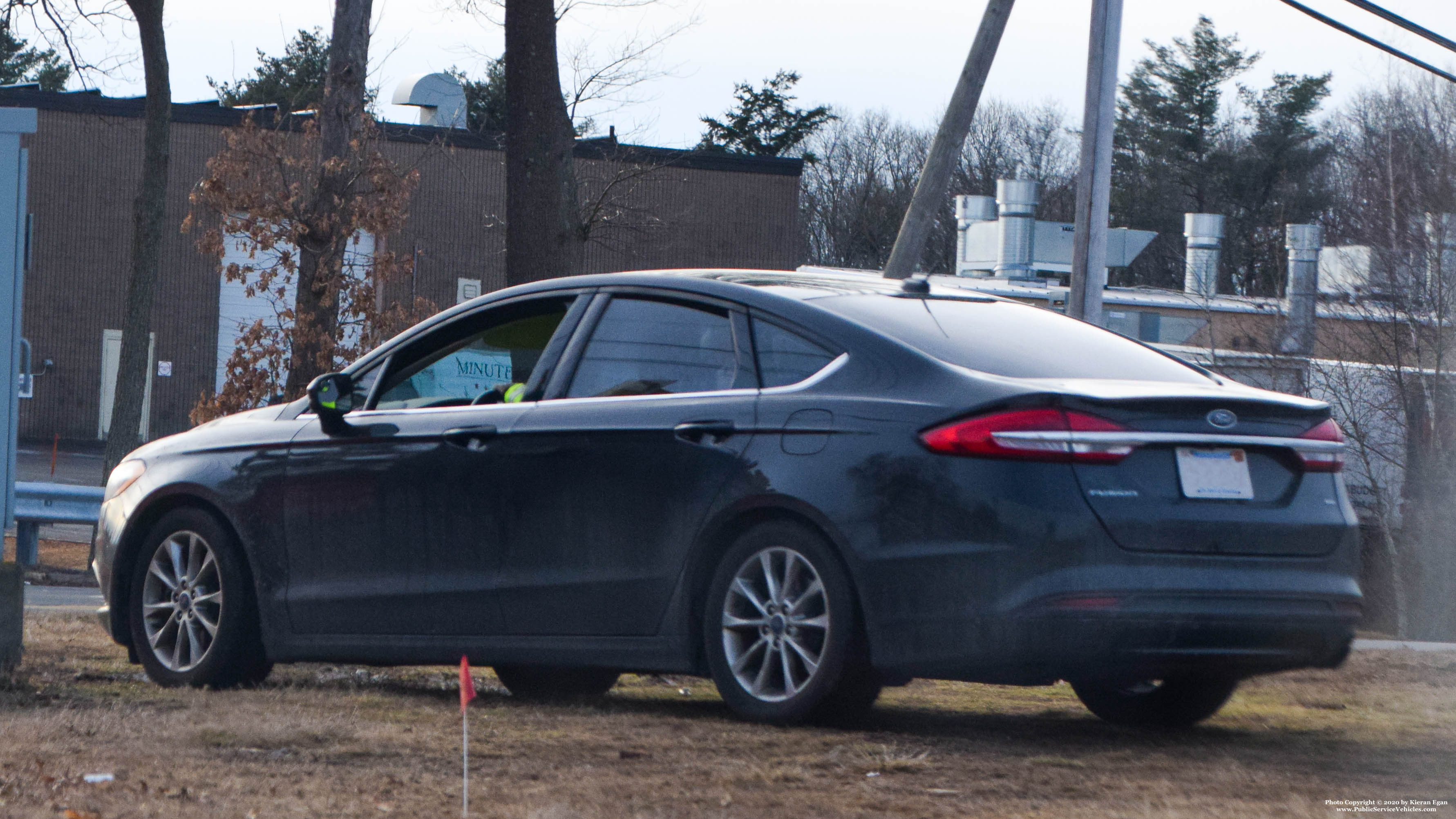 A photo  of Massachusetts State Police
            Unmarked Unit, a 2012-2019 Ford Fusion             taken by Kieran Egan