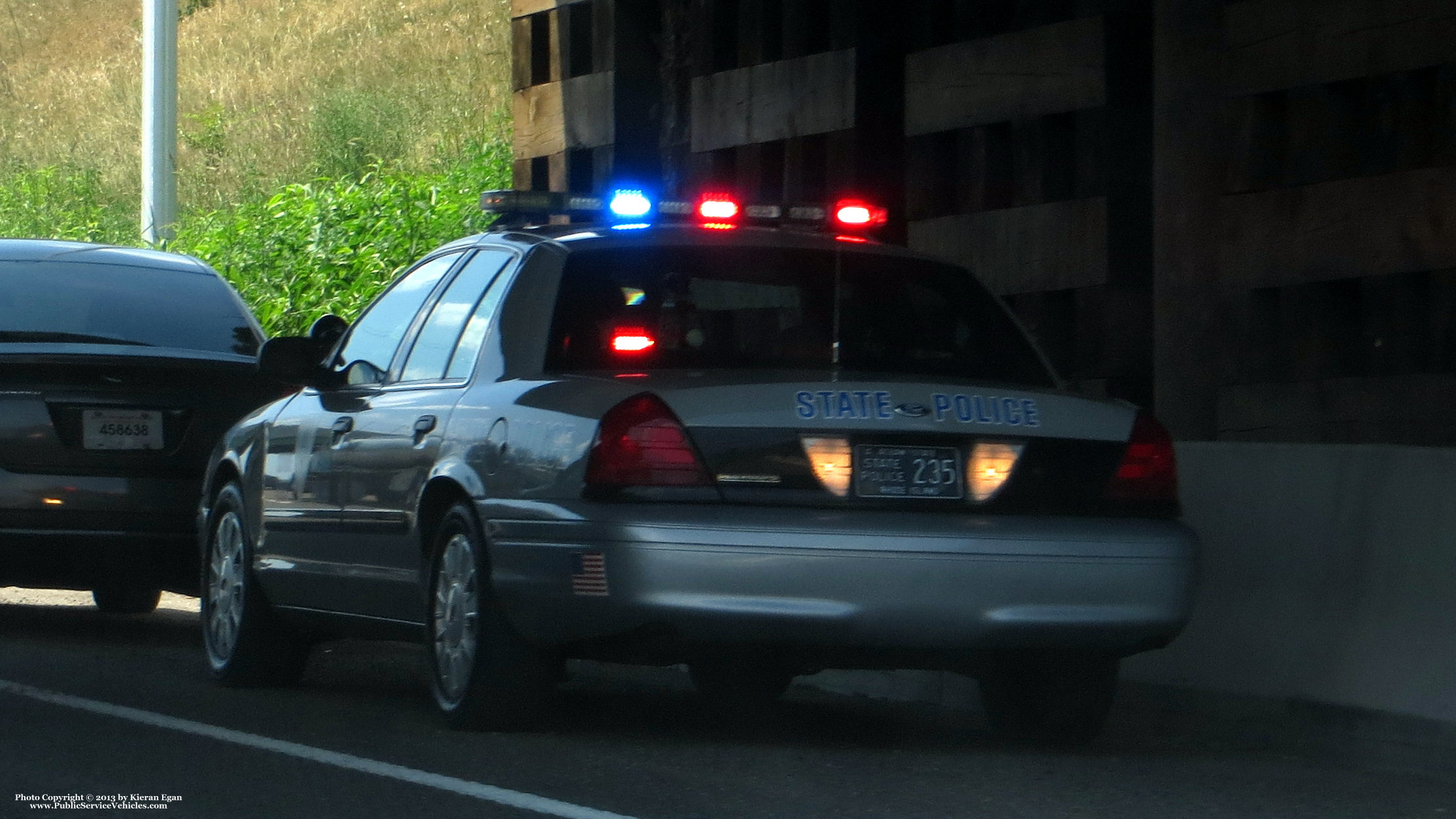 A photo  of Rhode Island State Police
            Cruiser 235, a 2006-2008 Ford Crown Victoria Police Interceptor             taken by Kieran Egan