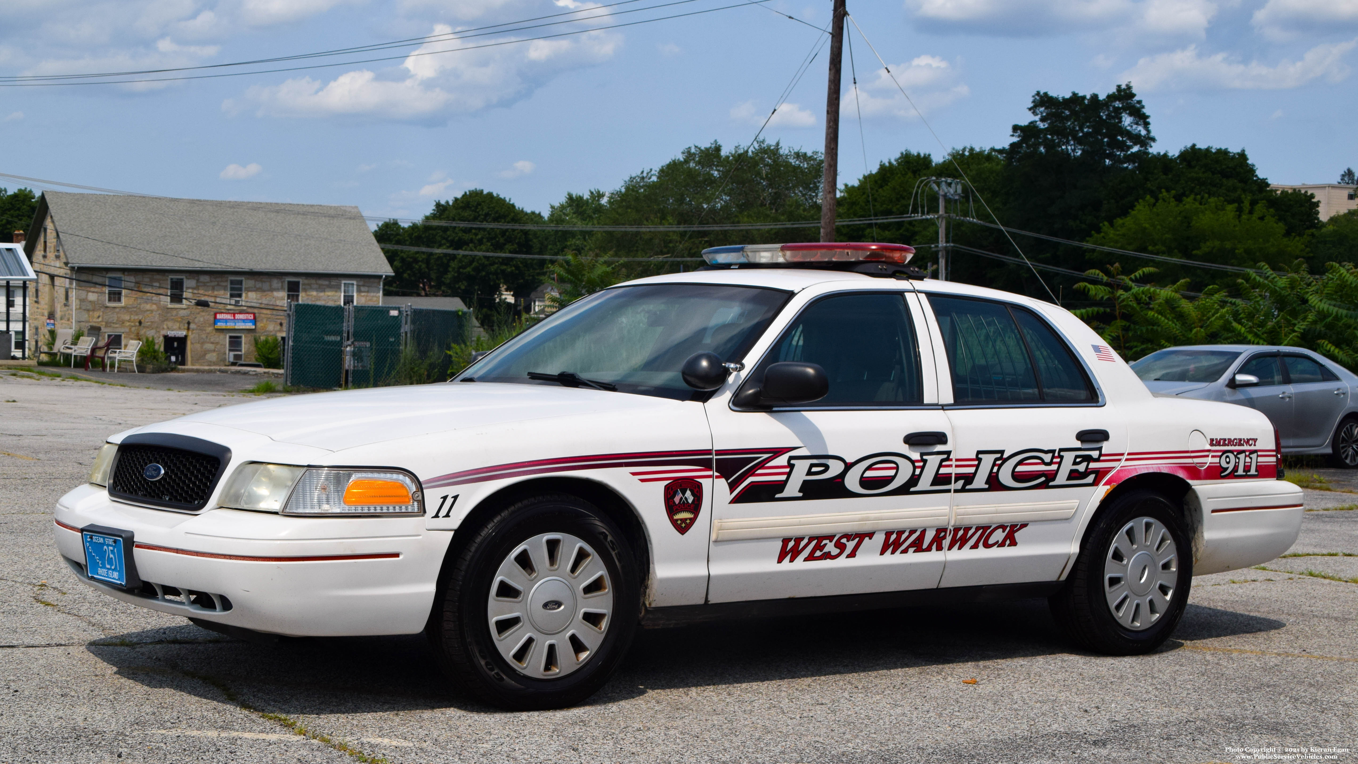 A photo  of West Warwick Police
            Car 11, a 2009-2011 Ford Crown Victoria Police Interceptor             taken by Kieran Egan