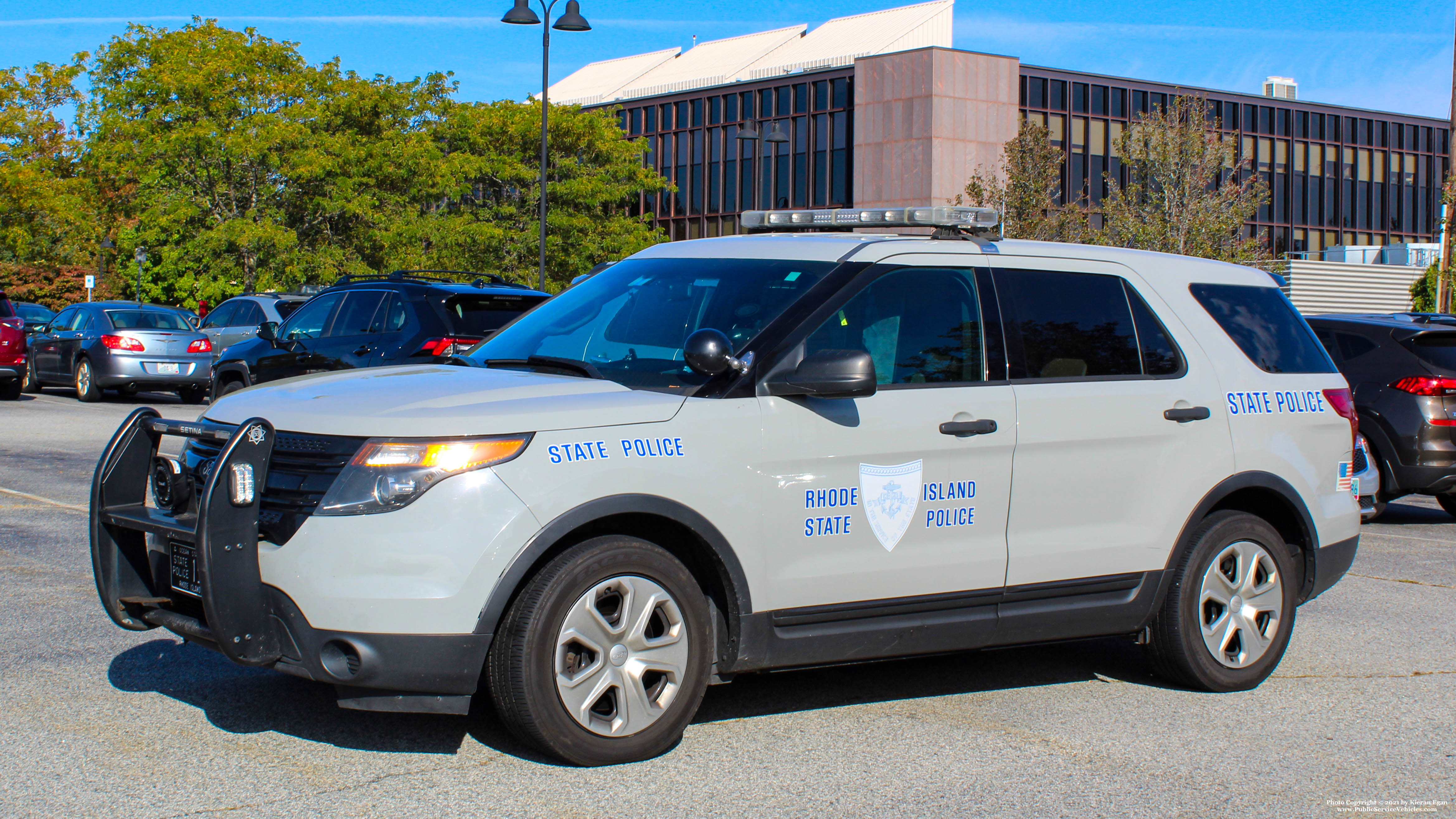 A photo  of Rhode Island State Police
            Cruiser 155, a 2013-2015 Ford Police Interceptor Utility             taken by Kieran Egan