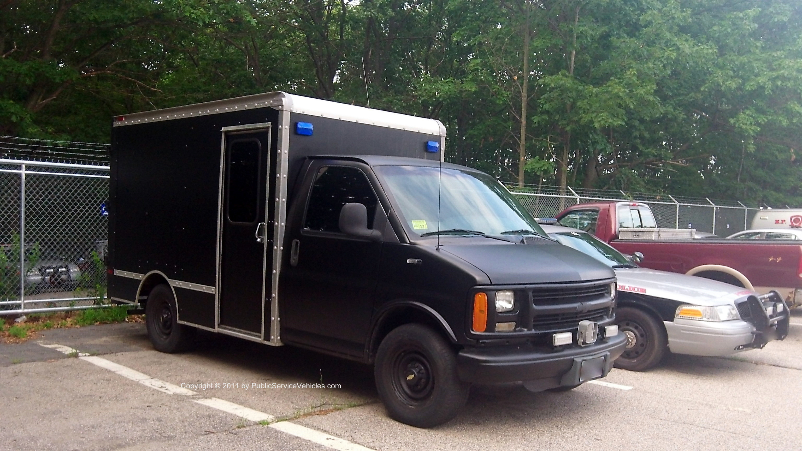 A photo  of East Providence Police
            SWAT Unit, a 1995-2002 Chevrolet Express             taken by Kieran Egan