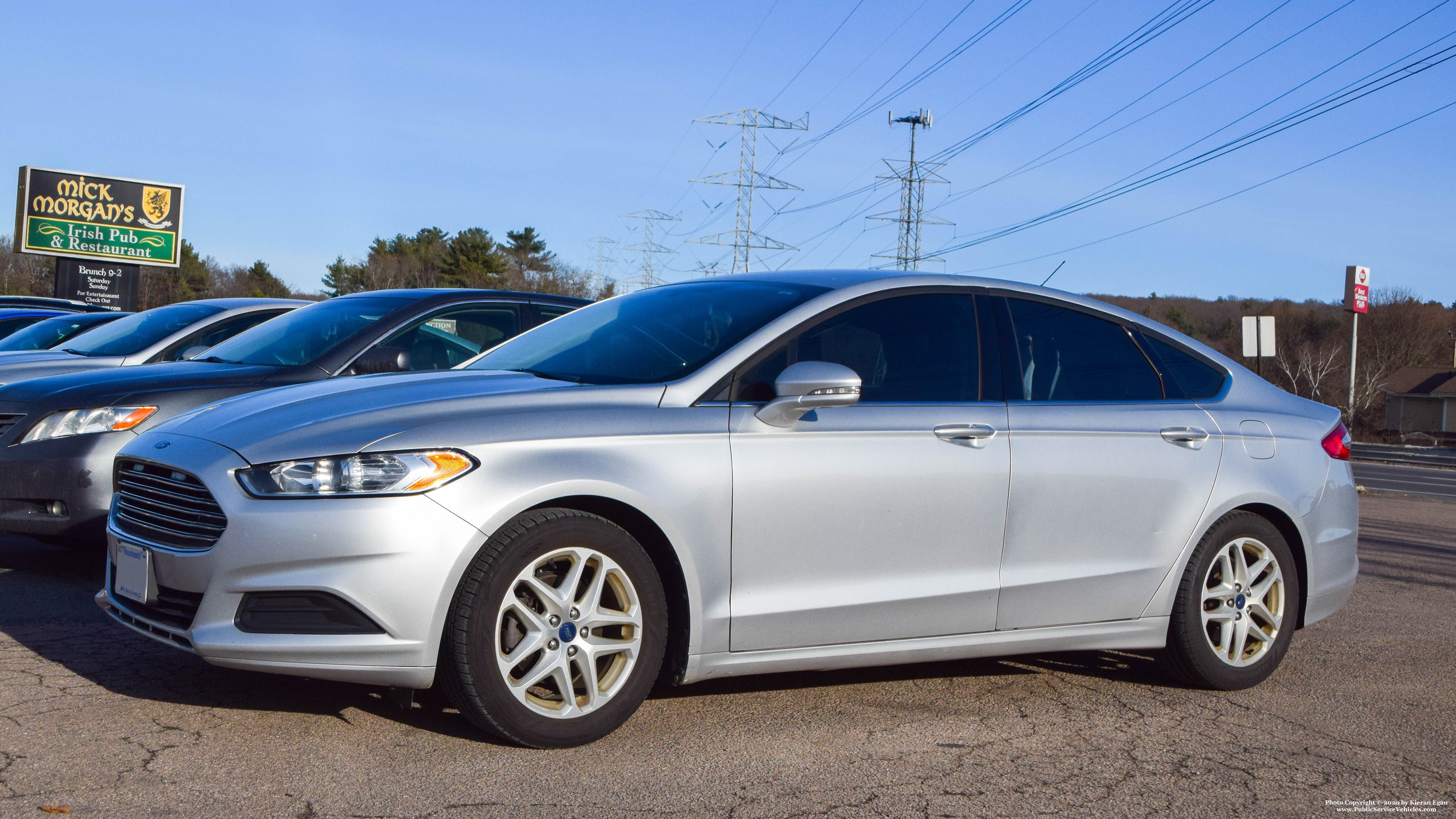 A photo  of Massachusetts State Police
            Unmarked Unit, a 2012-2019 Ford Fusion             taken by Kieran Egan