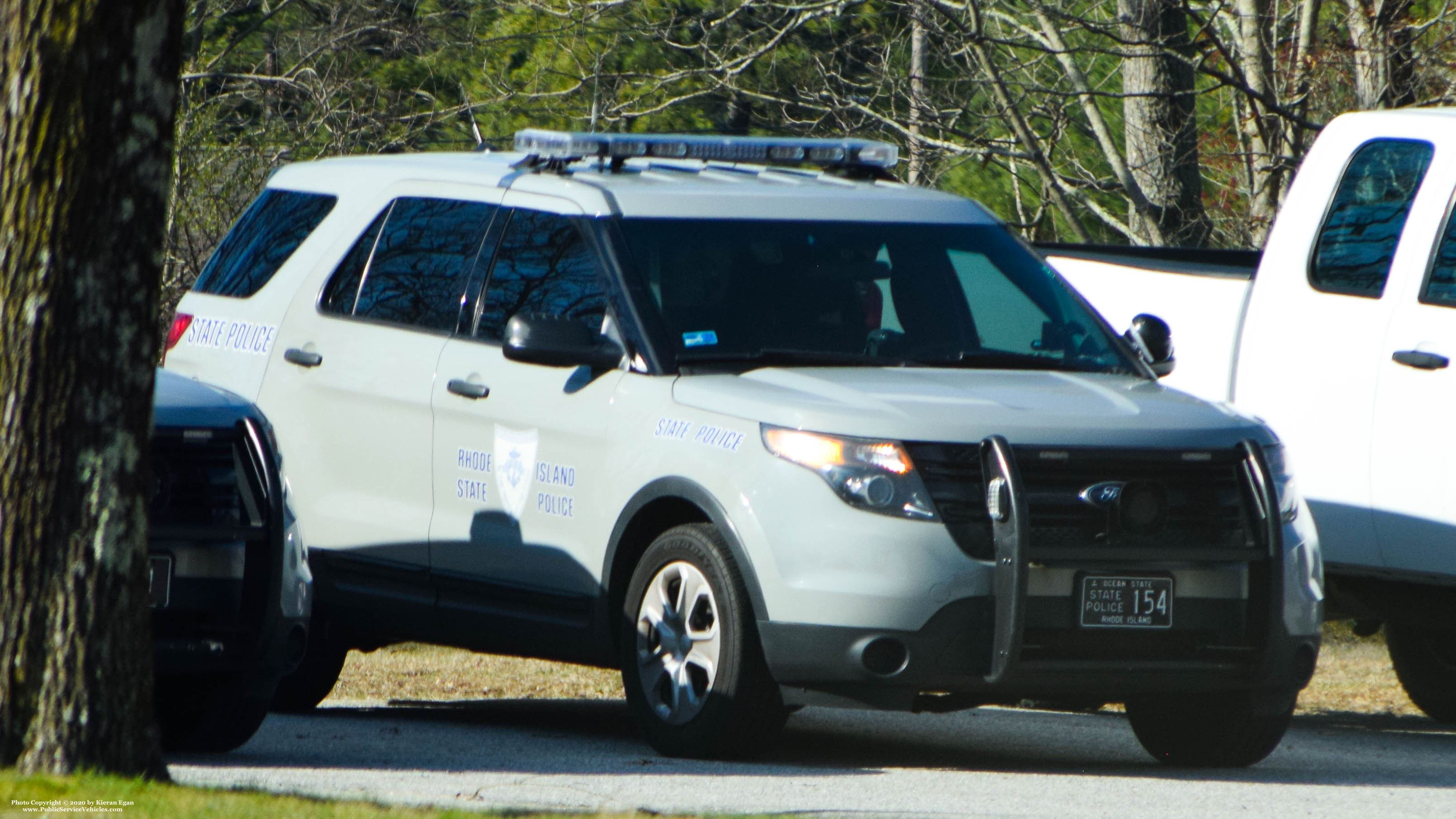 A photo  of Rhode Island State Police
            Cruiser 154, a 2013-2015 Ford Police Interceptor Utility             taken by Kieran Egan