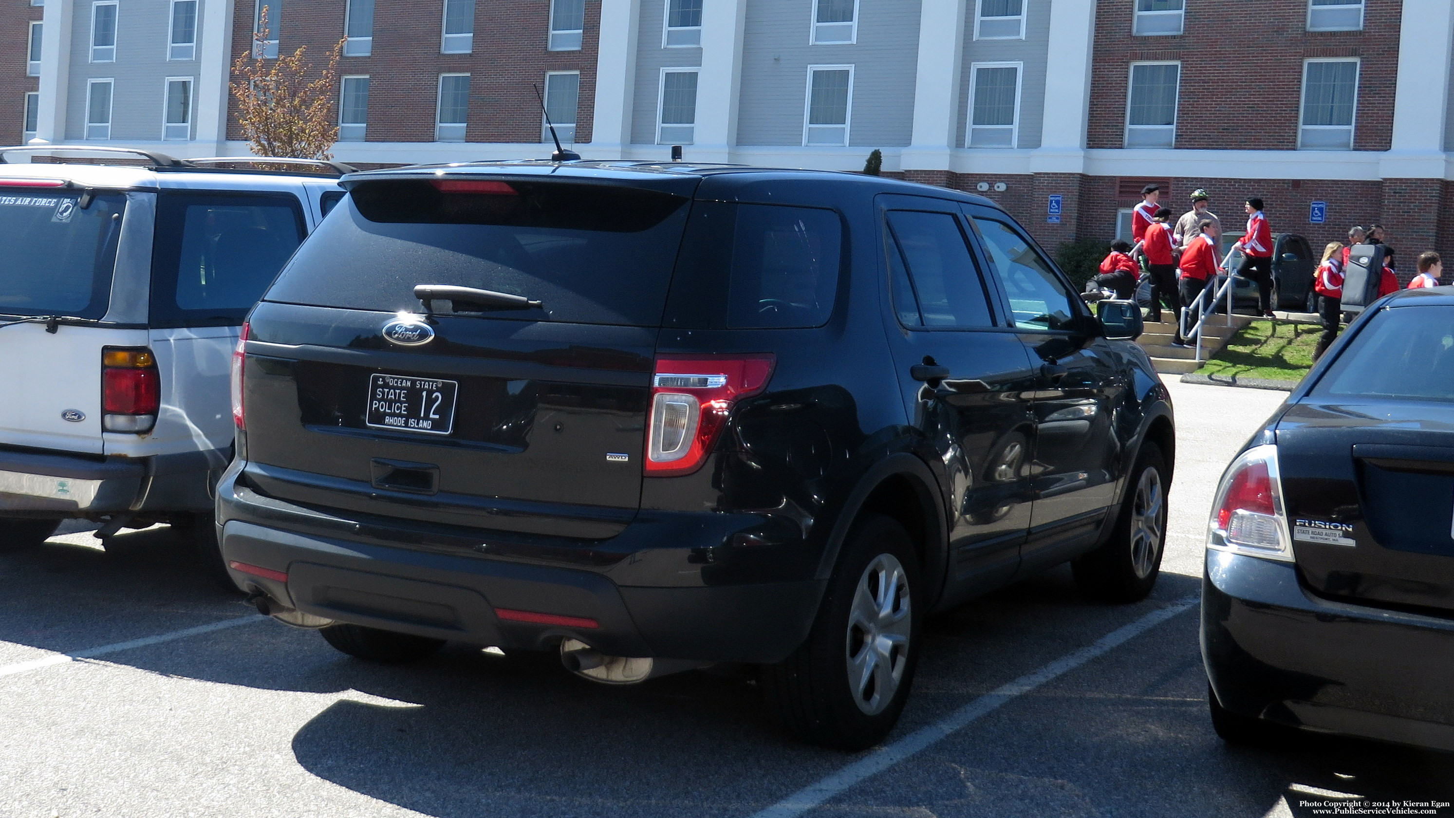 A photo  of Rhode Island State Police
            Cruiser 12, a 2013-2015 Ford Police Interceptor Utility             taken by Kieran Egan