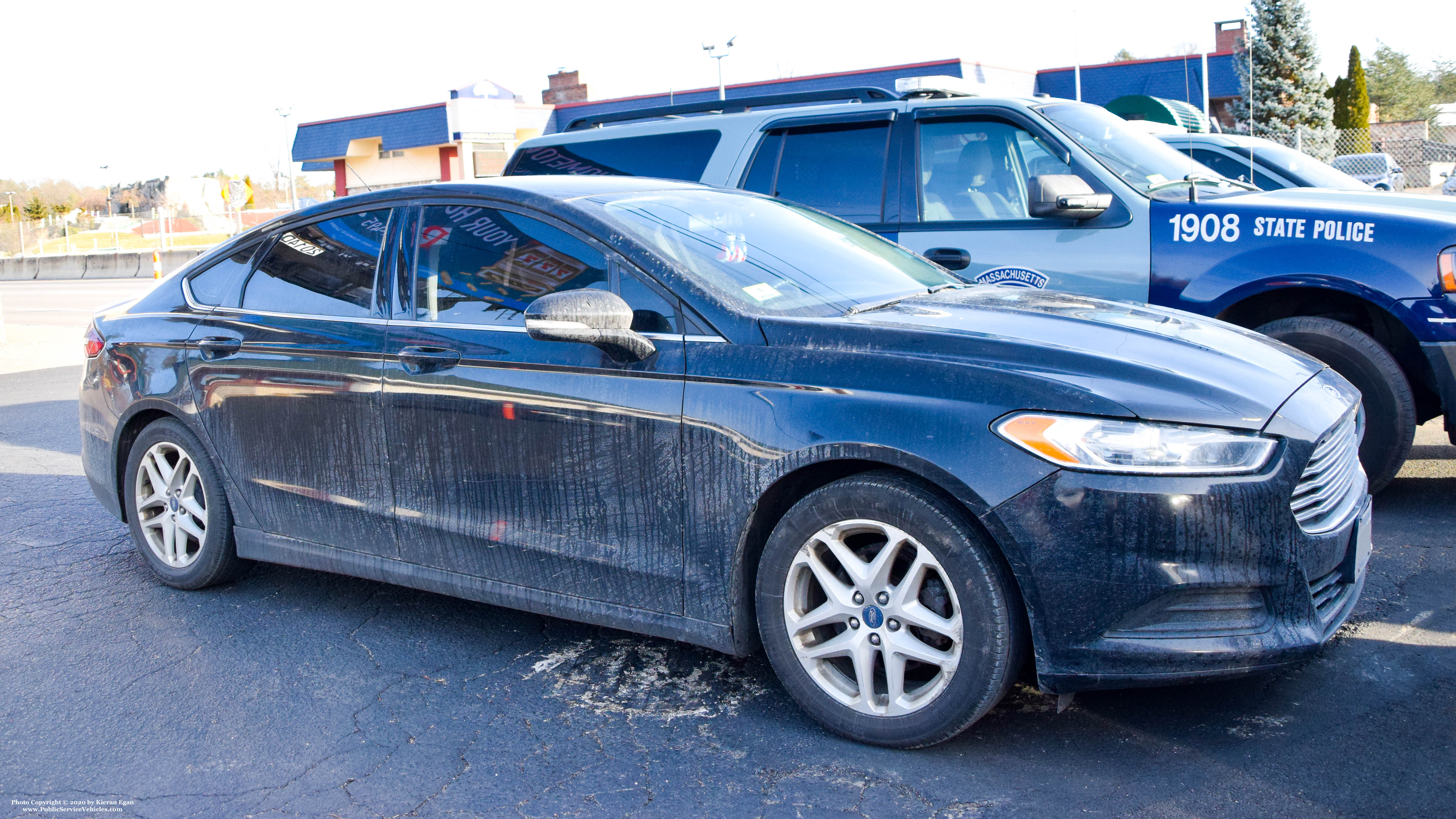 A photo  of Massachusetts State Police
            Unmarked Unit, a 2012-2019 Ford Fusion             taken by Kieran Egan