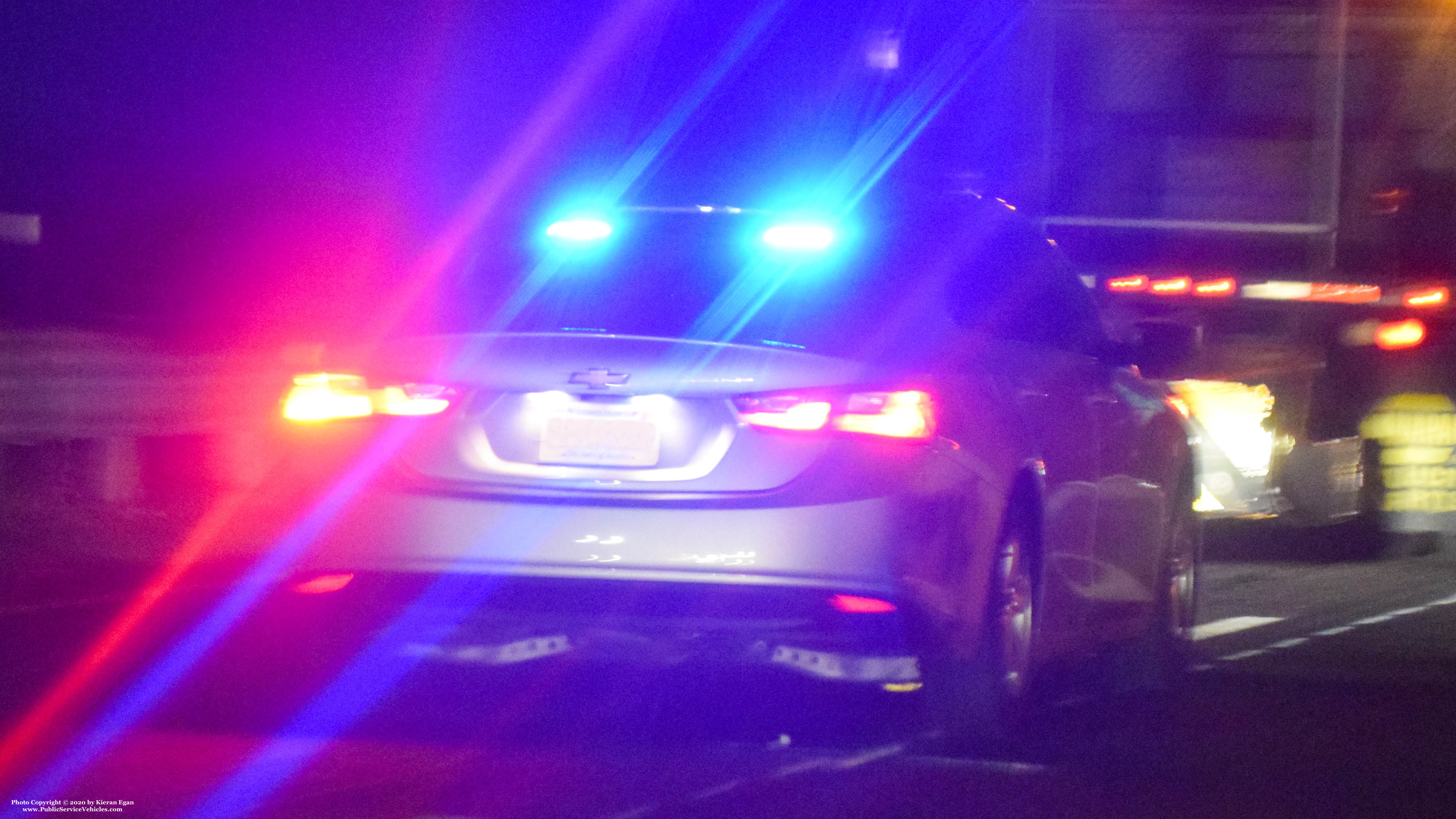 A photo  of Massachusetts State Police
            Unmarked Unit, a 2016-2018 Chevrolet Malibu             taken by Kieran Egan