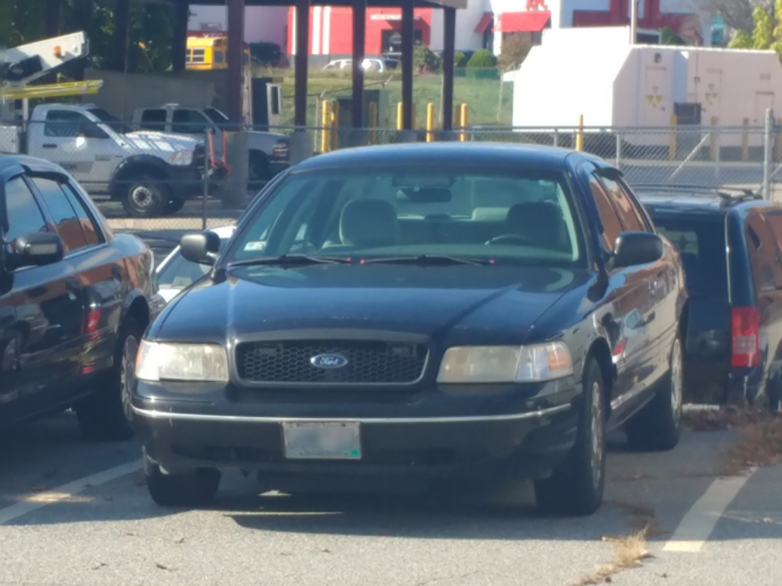 A photo  of Woonsocket Police
            Unmarked Unit, a 2003-2005 Ford Crown Victoria Police Interceptor             taken by Jamian Malo