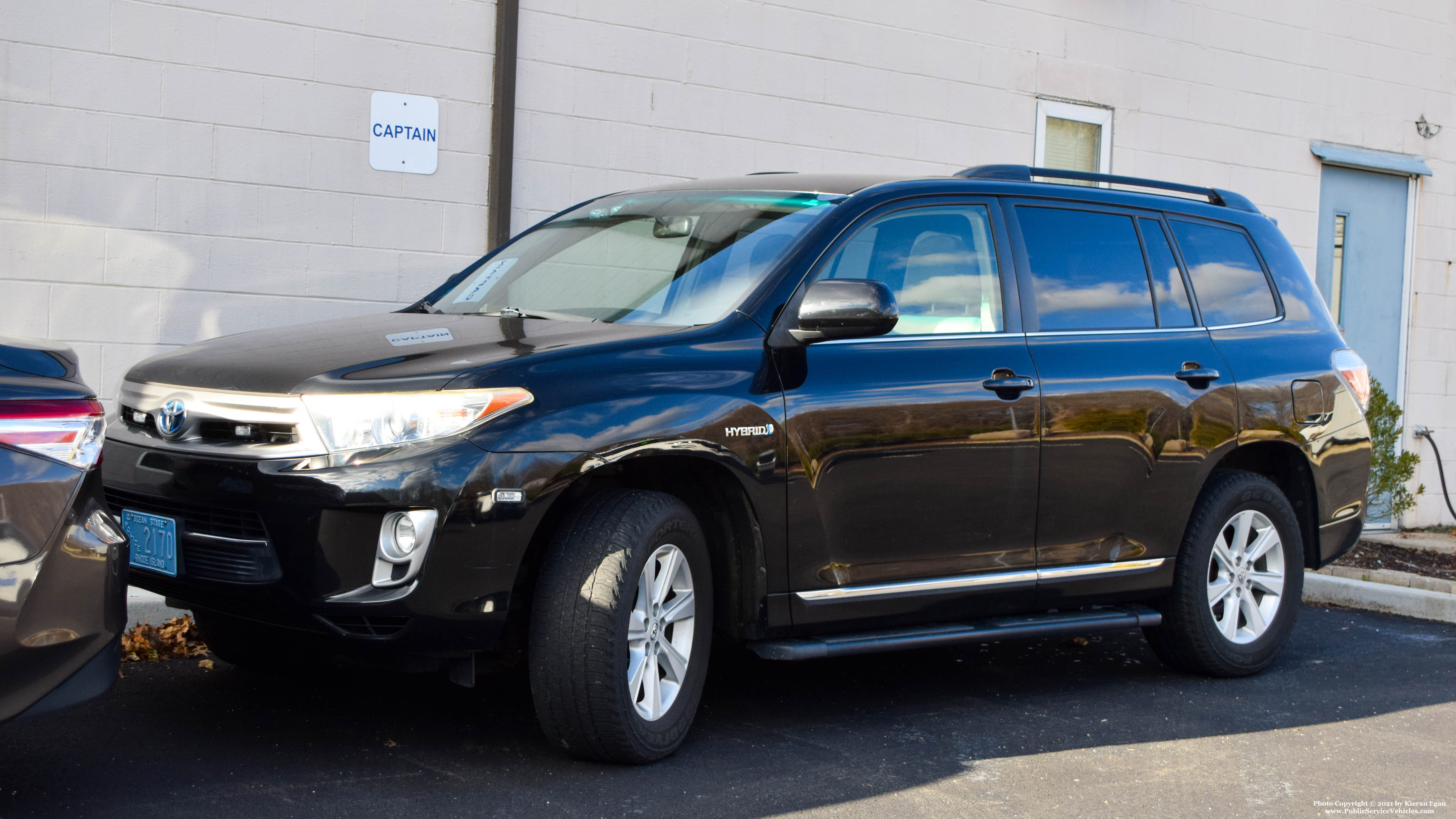 A photo  of University of Rhode Island Police
            Captain's Unit, a 2011-2013 Toyta Highlander Hybrid             taken by Kieran Egan