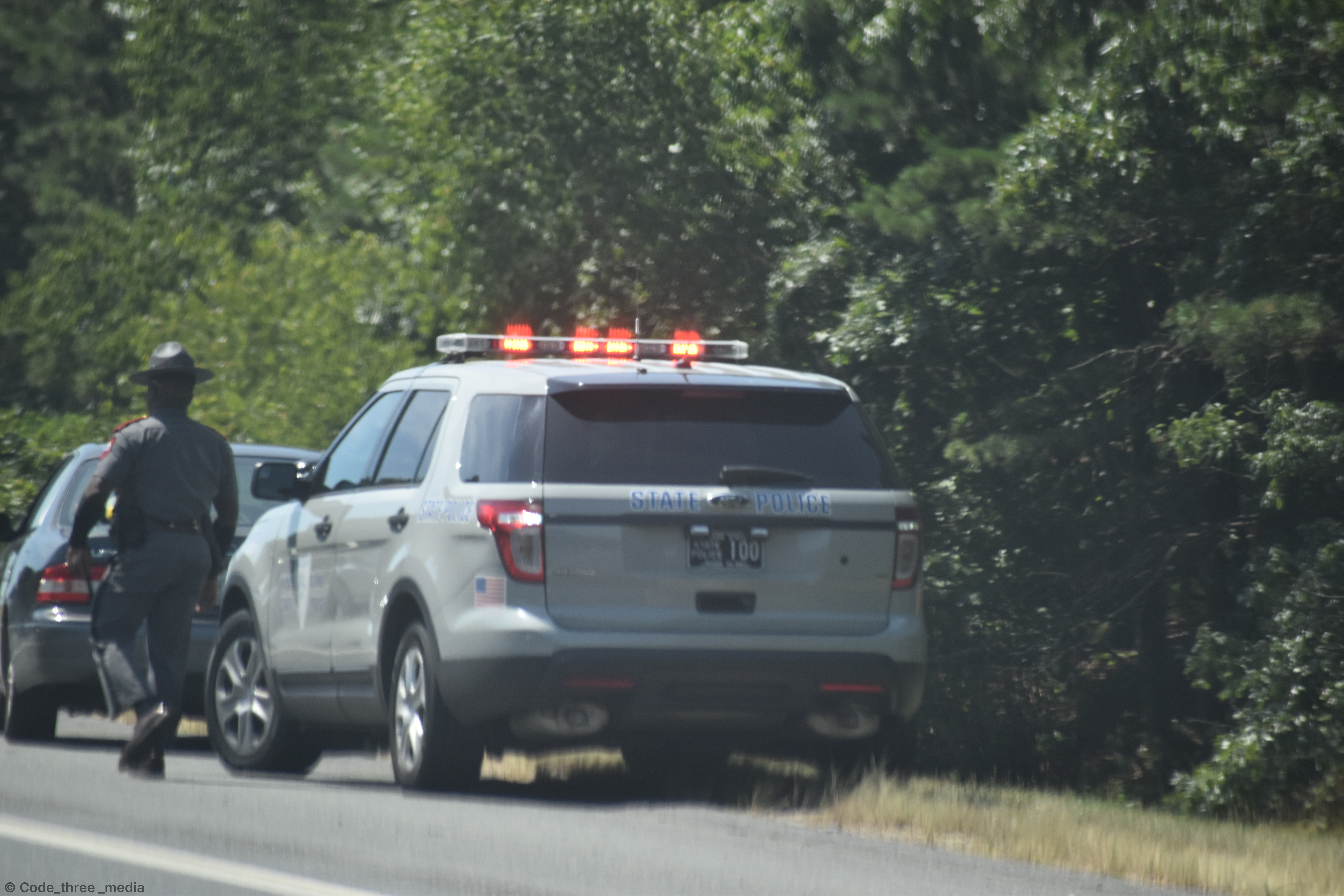 A photo  of Rhode Island State Police
            Cruiser 100, a 2013-2015 Ford Police Interceptor Utility             taken by Nate Hall