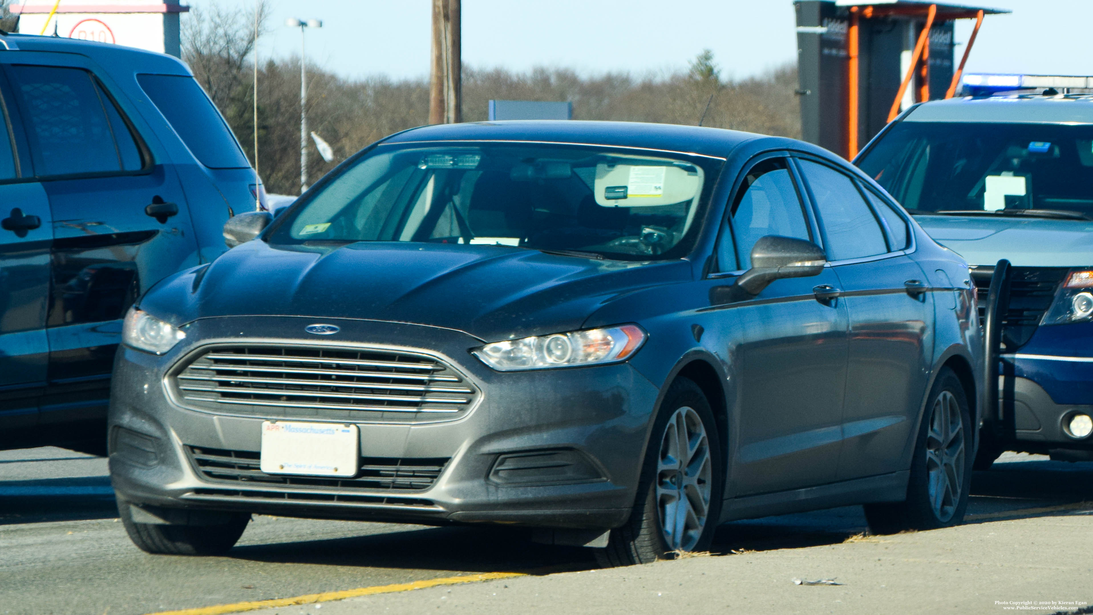 A photo  of Massachusetts State Police
            Unmarked Unit, a 2012-2019 Ford Fusion             taken by Kieran Egan