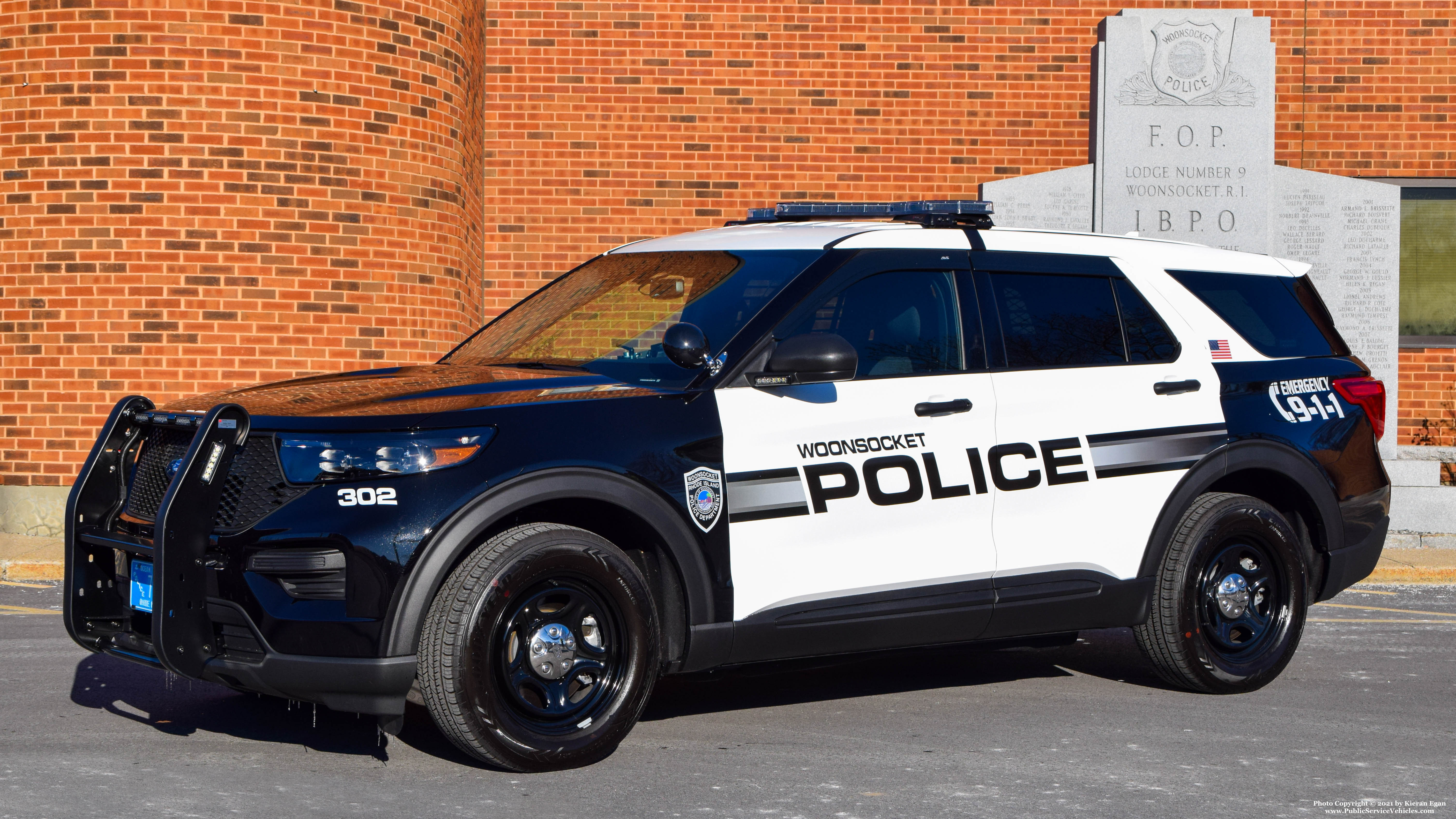 A photo  of Woonsocket Police
            Cruiser 302, a 2021 Ford Police Interceptor Utility             taken by Kieran Egan