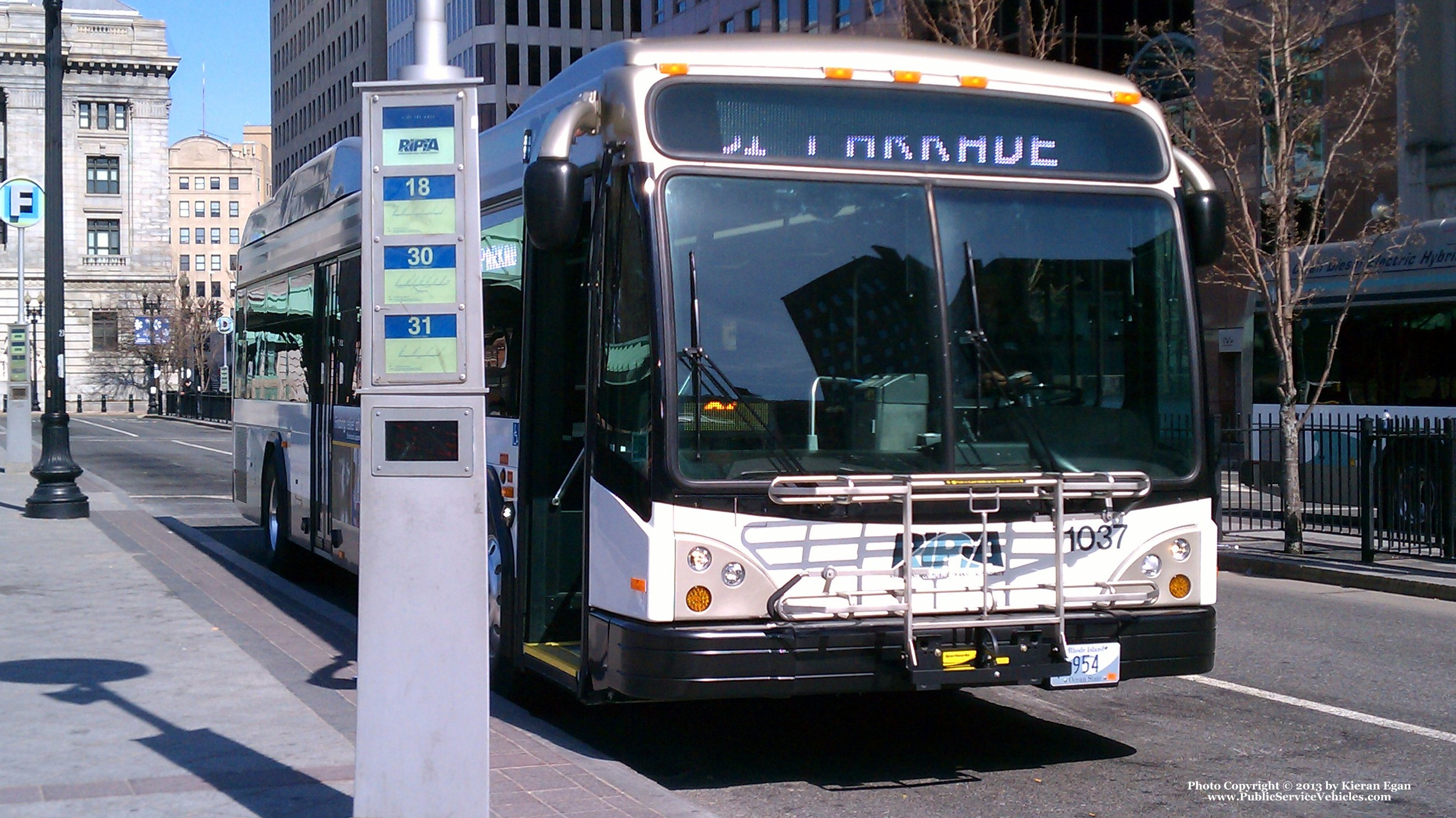 A photo  of Rhode Island Public Transit Authority
            Bus 1037, a 2010 Gillig BRT HEV             taken by Kieran Egan
