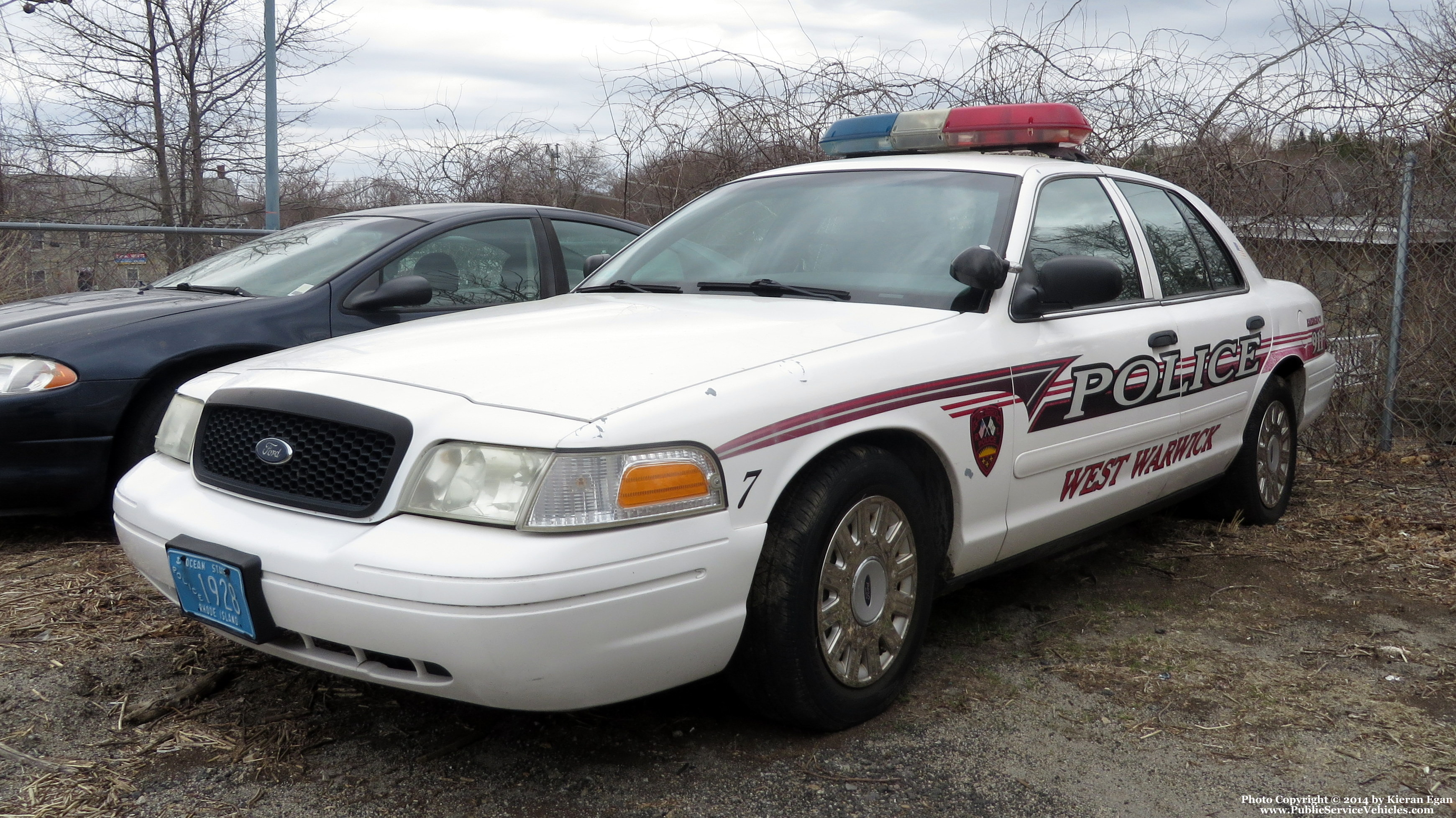 A photo  of West Warwick Police
            Car 7, a 2003-2005 Ford Crown Victoria Police Interceptor             taken by Kieran Egan