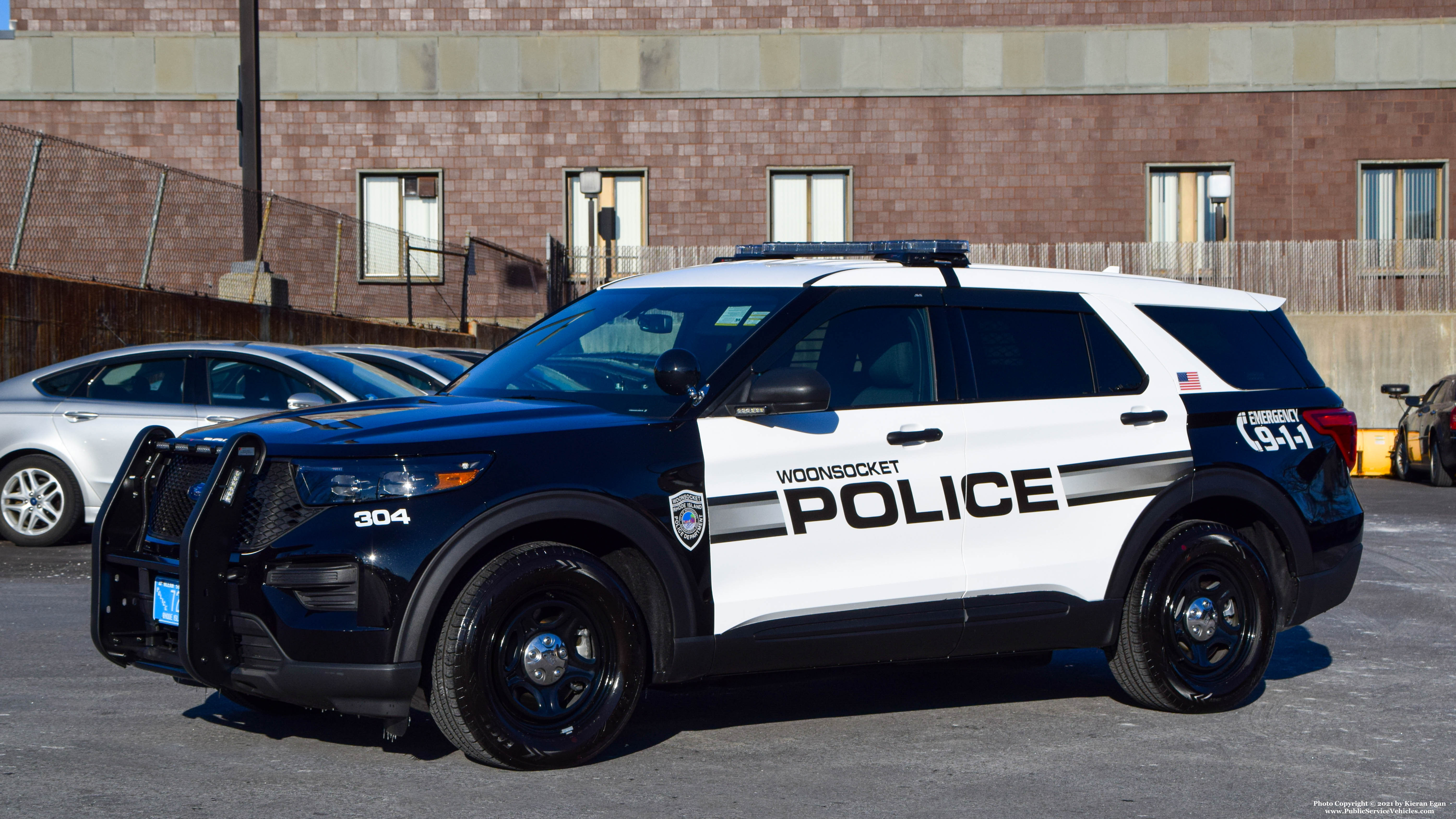 A photo  of Woonsocket Police
            Cruiser 304, a 2021 Ford Police Interceptor Utility             taken by Kieran Egan