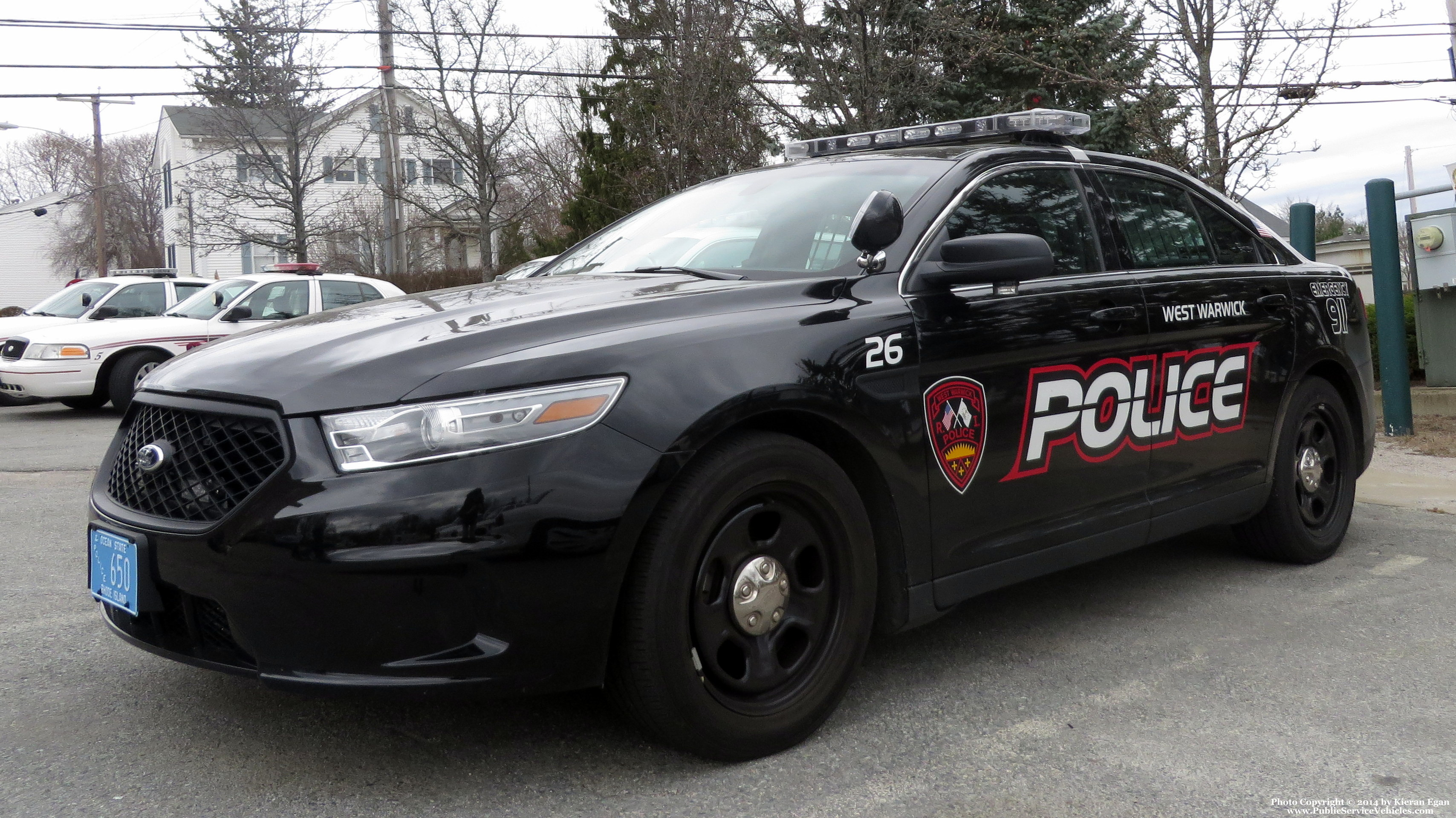 A photo  of West Warwick Police
            Car 26, a 2013-2014 Ford Police Interceptor Sedan             taken by Kieran Egan